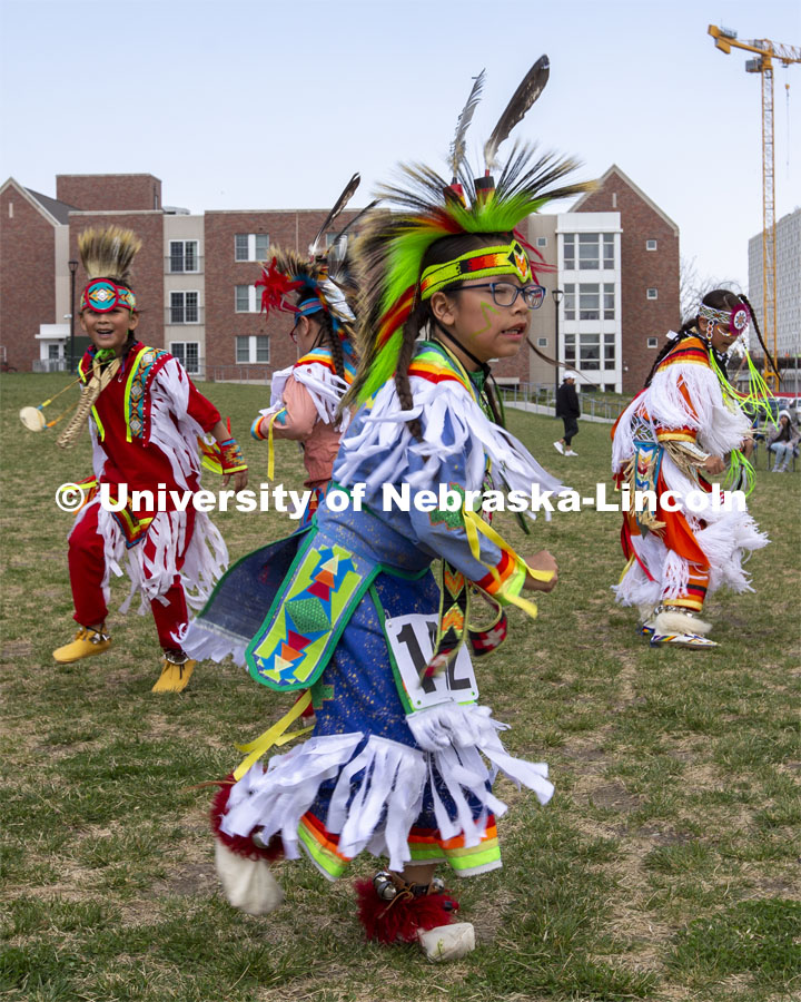 Young dancers compete for prizes during the 2022 UNITE powwow. 2022 UNITE powwow to honor graduates (K through college). Held April 23 on the greenspace along 17th Street, immediately west of the Willa Cather Dining Center. This was UNITE’s first powwow in three years. The MC was Craig Cleveland Jr. Arena director was Mike Wolfe Sr. Host Northern Drum was Standing Horse. Host Southern Drum was Omaha White Tail. Head Woman Dancer was Kaira Wolfe. Head Man Dancer was Scott Aldrich. Special contest was a Potato Dance. April 23, 2023. Photo by Troy Fedderson / University Communication.